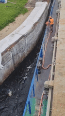 Vessel transits canal lock 5 in Markovo, Russia