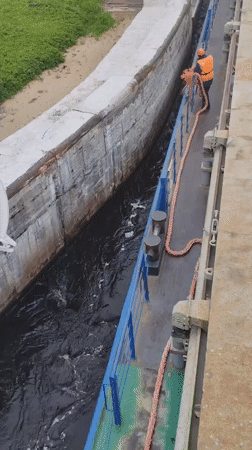 Vessel transits canal lock 5 in Markovo, Russia