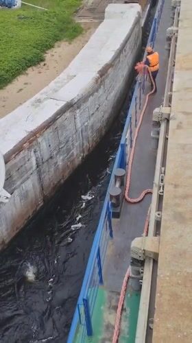 Vessel transits canal lock 5 in Markovo, Russia