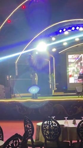 Live brass band and vocalist perform at outdoor night event in Baku