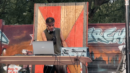 DJ performs outdoor set in Milan during evening hours