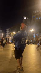 Nighttime street sports activity captured in public square