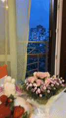Romantic table setting captured on Sochi balcony at dusk
