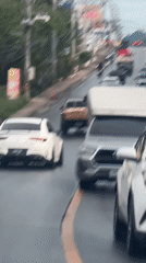 Traffic flows on wet streets in Baan Bo Phut