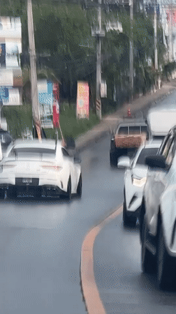 Traffic flows on wet streets in Baan Bo Phut