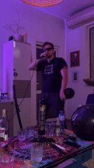Man performs karaoke with balloon in Sofia nighttime venue