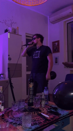 Man performs karaoke with balloon in Sofia nighttime venue