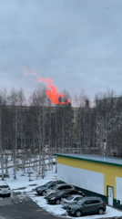 Bright red cloud observed rising behind building in Surgut