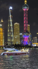 Yacht cruise along the Shanghai skyline at night