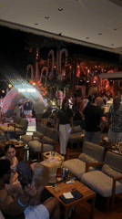 Evening social gathering documented at Kuta Selatan bar venue