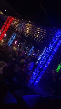 Night at a lit-up lounge and club in Howayi, Nigeria