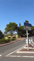 Junction signs near La Turbie point toward Nice and the A8