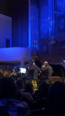 Orchestra performs in Kazan concert hall with cellists featured