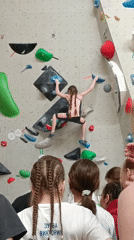 Woman rock climbing at indoor facility in Krasnoyarsk