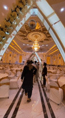 Ornate Kandahar wedding hall, inside and out at night