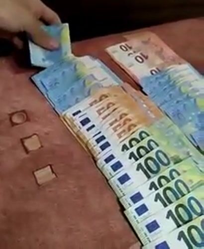 Person arranges Euro banknotes in Yambol, Bulgaria