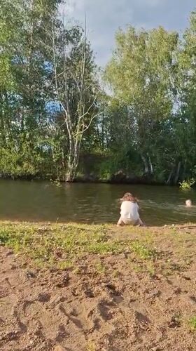 Afternoon swim at a shady riverbank in Innolovo