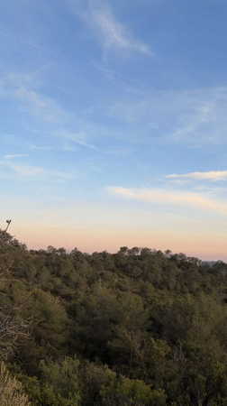 Sunset observed over green hills in Estivella, Spain