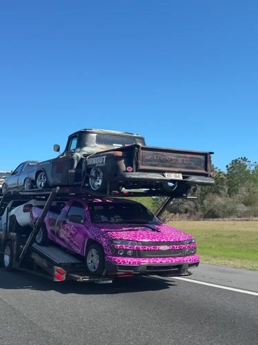 Car hauler transports vehicles on highway near White Springs