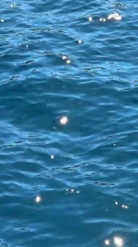 Sunlit water surface captured in Greek coastal municipality