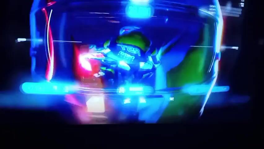 The video shows a close-up of a motorcycle helmet with a reflective visor. The helmet is dark with bright, colorful lights reflecting off its surface. The lights are a mix of blues, reds, and whites, creating a vibrant and dynamic visual effect. The camera slowly zooms in and pans across the helmet, highlighting its sleek design and the intricate details of the visor. The background is black, which makes the reflections on the helmet stand out even more. The video appears to be a short promotional clip or a visualizer for music, focusing on the aesthetic appeal of the helmet.
