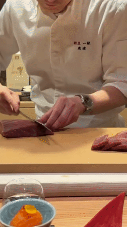 Chef prepares tuna sashimi in Minato City, Japan