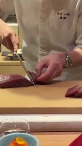 Chef prepares tuna sashimi in Minato City, Japan