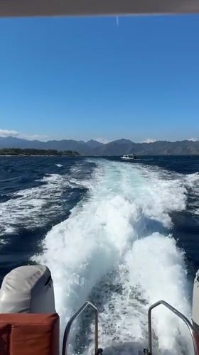Boat cuts through Indonesian waters off Lombok's coast.