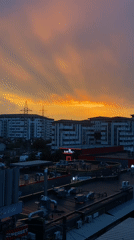 City sunset and street flooding captured across one stormy evening