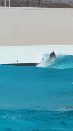Surfer rides artificial waves at Tel Aviv wave pool facility