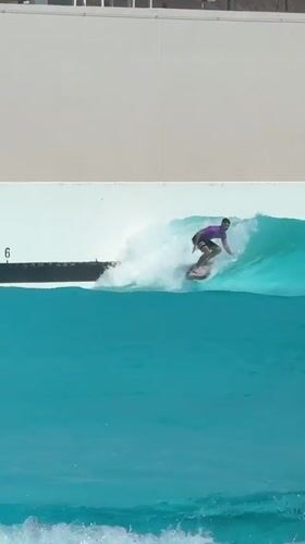 Surfer rides artificial waves at Tel Aviv wave pool facility