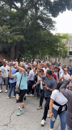 Street procession draws diverse crowd in Caracas, Venezuela