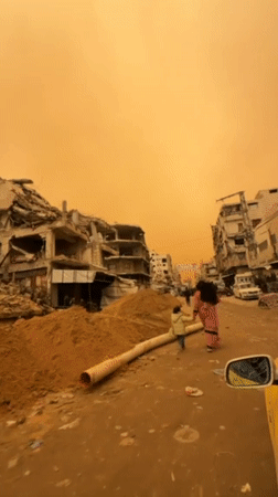 Gaza residents navigate dust storm through war-damaged streets