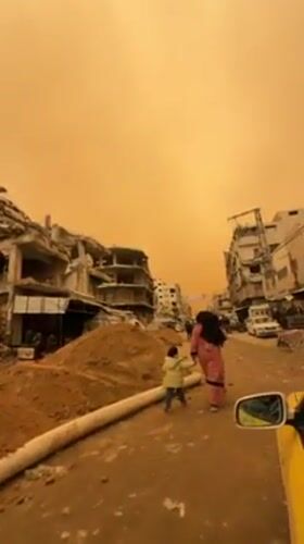 Gaza residents navigate dust storm through war-damaged streets