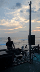 Tourist activities and DJ performance captured at North Kuta beach