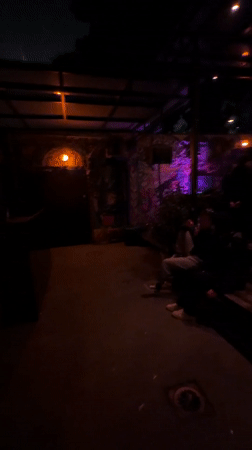 Evening gathering at illuminated outdoor venue in Haifa