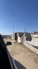 Gaza street scenes with makeshift structures and filming setup