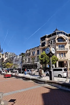 Everyday street life documented across Batumi, Georgia during sunny morning