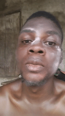 Man takes selfies with white face powder in Nigeria