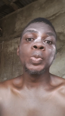Man takes selfies with white face powder in Nigeria