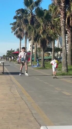 Sunny afternoon leisure activities captured on Batumi seaside promenade
