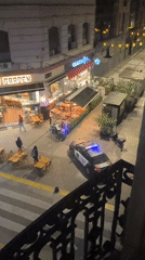 Nighttime street scene captured outside Buenos Aires restaurant district