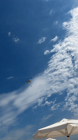 Beach day in Nesebar: parasailing, loungers, and a cold drink