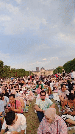 Outdoor concert on Champ de Mars, Eiffel Tower as backdrop