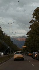 Evening street scene captured in Blagoevgrad with mountain backdrop