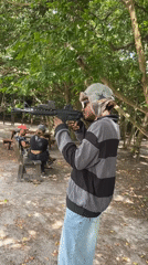 Person fires airsoft gun in wooded area in Lekki