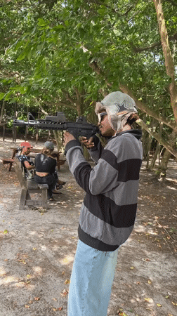 Person fires airsoft gun in wooded area in Lekki