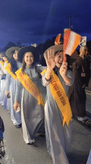 Buddhist procession with illuminated dragon floats parades through Da Lat