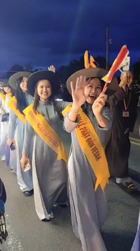 Buddhist procession with illuminated dragon floats parades through Da Lat