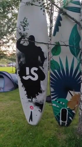 Paddleboarding and camping at a calm Russian lake